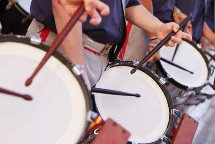 Close up view of people playing drums in a parade