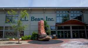 Exterior view of the LL Bean company with a large pink and brown boot
