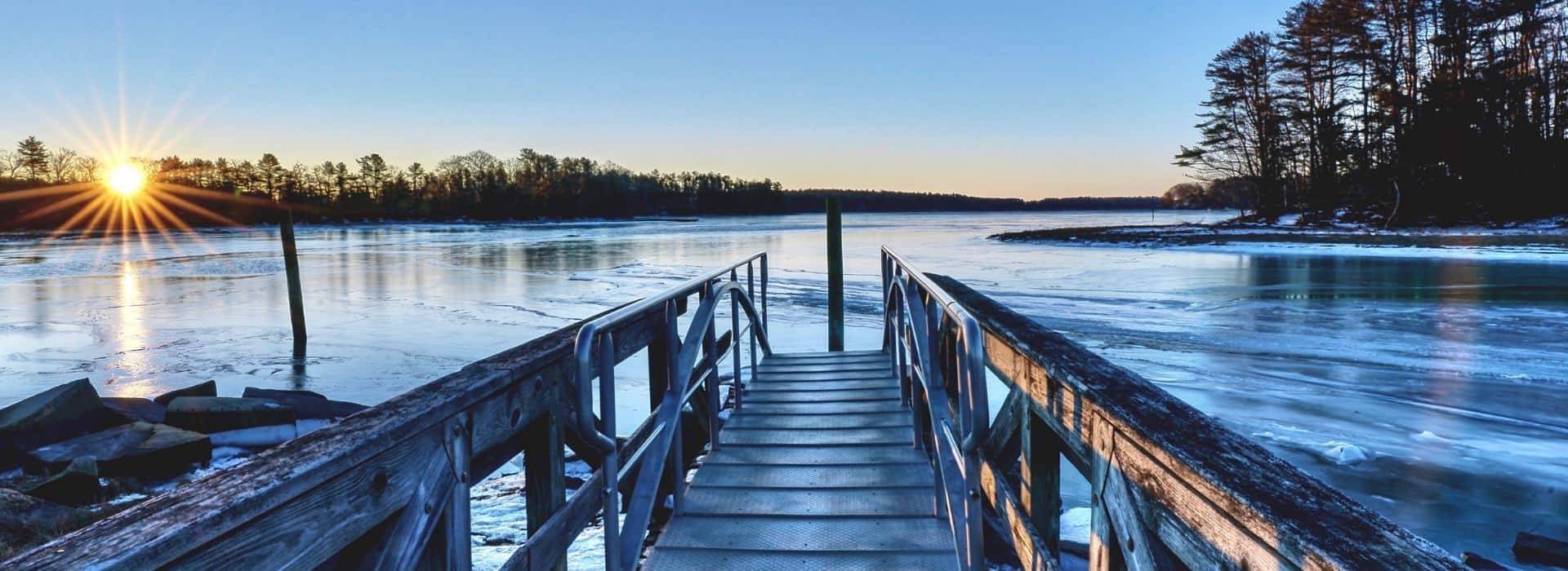 Scenic winter sunrise over a coastal dock near Brewster House Bed & Breakfast in Freeport, Maine